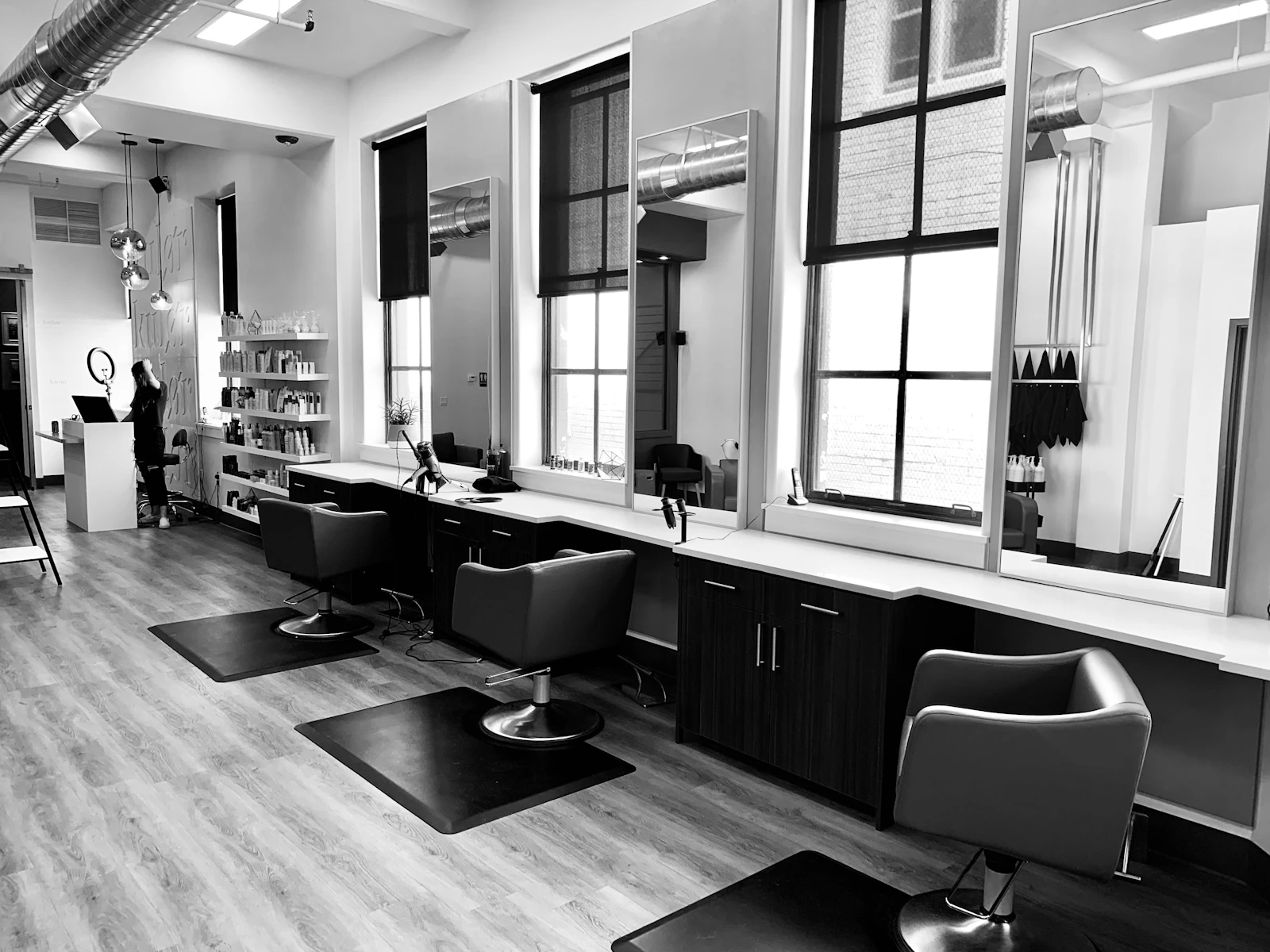 Modern hair salon interior with styling chairs and mirrors